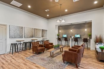 Community room with seating and a wall with computers